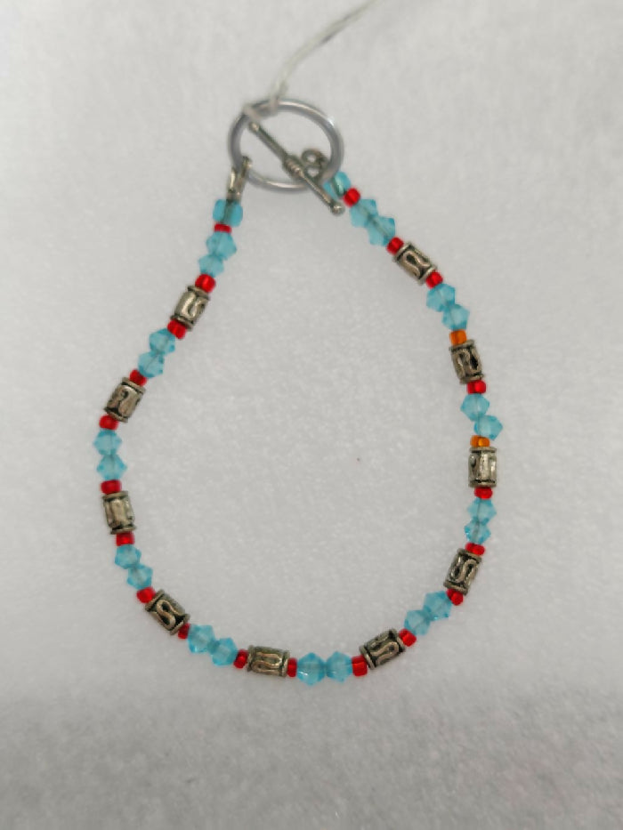 B#214 7 inch, 10 metal tubes, Lt. Blue 2mm Crystals, Red Seed beads Glass, Toggle Closure