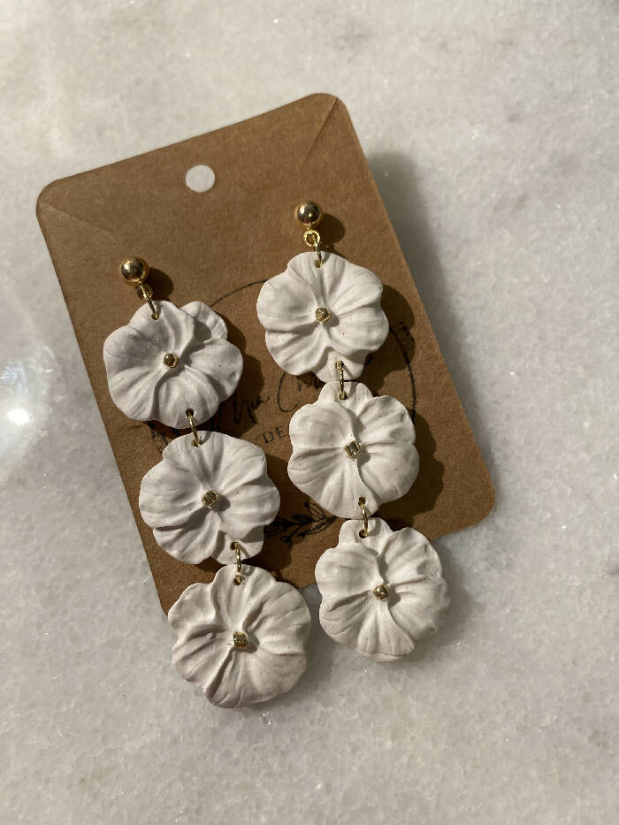 Three white flower dangle